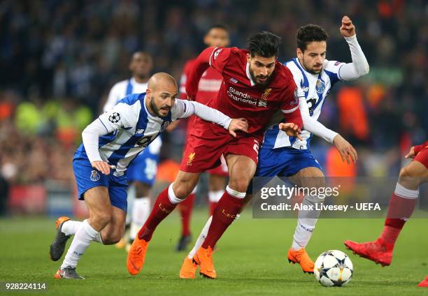 Emre Can of Liverpool takes on Andre Andre and Bruno Costa of FC Porto during the UEFA Champions League Round of 16 Second Leg match between...