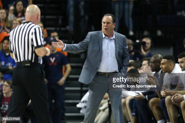 Notre Dame head coach Mike Brey complains to official Tim Comer . The University of Virginia Cavaliers hosted the University of Notre Dame Fighting...