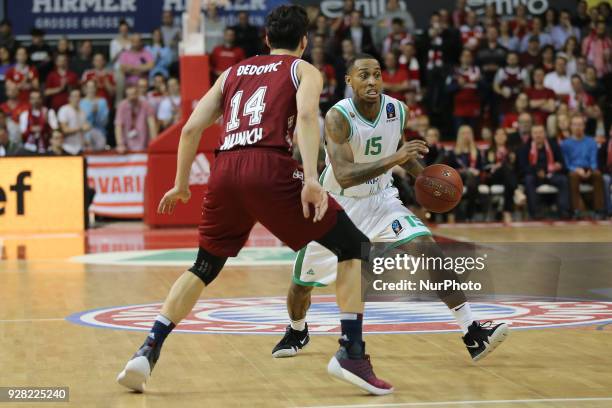 Nihad Dedovic of Bayern Muenchen vies Jamar Smith of Unics Kazan during the EuroCup Quarterfinal Round 1 match between FC Bayern Munich and Unics...