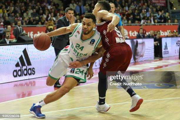 Jared Cunningham of Bayern Muenchen vies Trent Lokett of Unics Kazan during the EuroCup Quarterfinal Round 1 match between FC Bayern Munich and Unics...