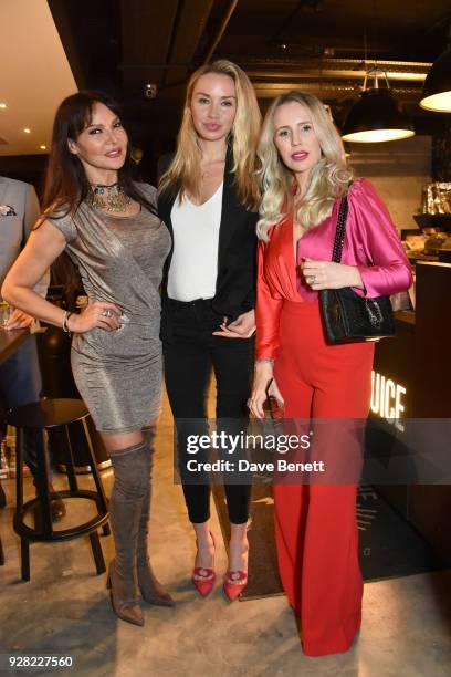 Lizzie Cundy, Noelle Reno and Naomi Isted attend the opening of "FRAME", an exhibition of photographs by Alan Chapman, at BXR London on March 6, 2018...