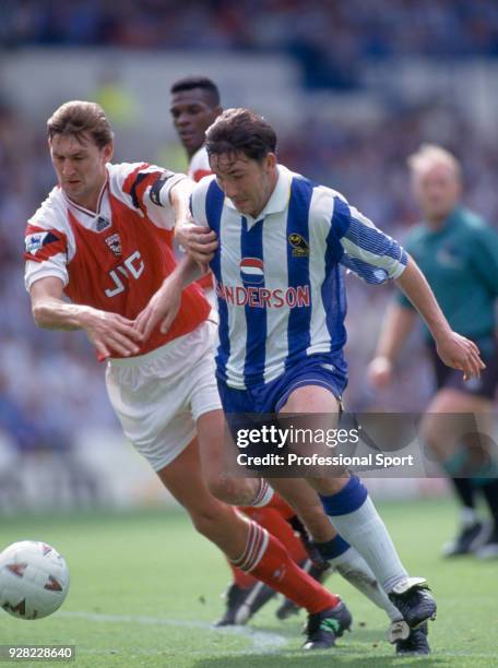 David Hirst of Sheffield Wednesday is challenged by Tony Adams of Arsenal during an FA Carling Premiership match at Hillsborough on August 21, 1993...