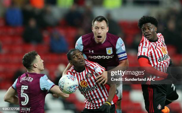 Aston Villa's captain John Terry, center, battles for the ball with Sunderland's Joel Asoro, left, and Josh Maja, right, during the Sky Bet...