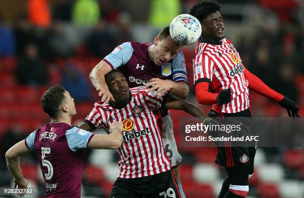 Aston Villa's captain John Terry, center, battles for the ball with Sunderland's Joel Asoro, left, and Josh Maja, right, during the Sky Bet...