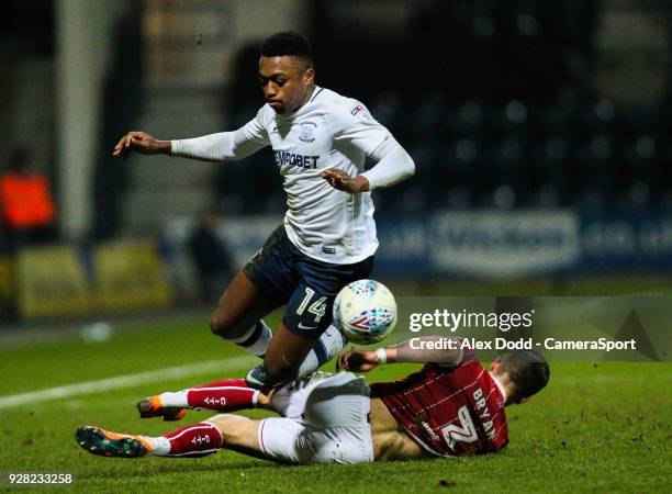 Preston North End's Darnell Fisher is tackled by Bristol City's Joe Bryan during the Sky Bet Championship match between Preston North End and Bristol...