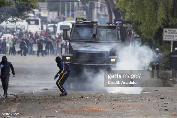 Protestors clash with riot police after clashes broke out between students and riot police during a protest due to dissatisfaction of educational...