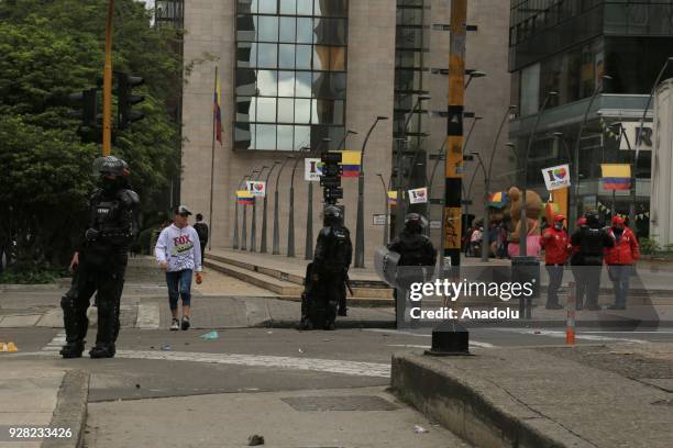 Riot police block the road as they attempt to disperse protestors after clashes broke out between students and riot police during a protest due to...