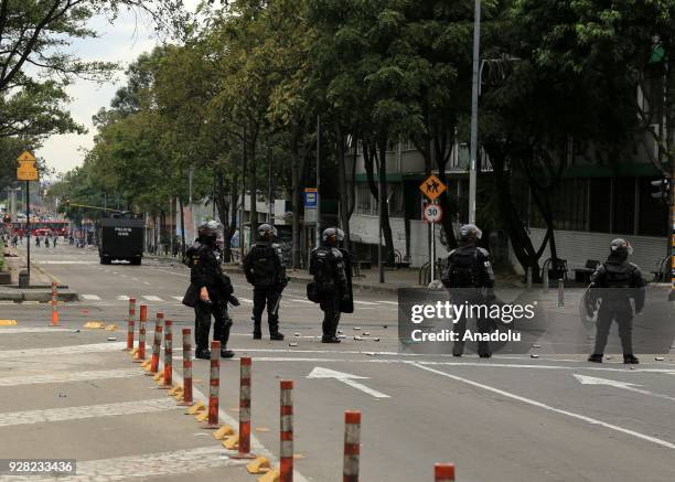 Riot police block the road as they attempt to disperse protestors after clashes broke out between students and riot police during a protest due to...