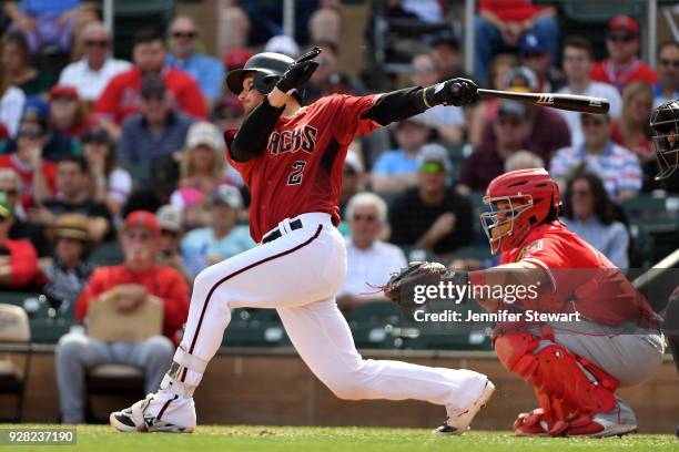 Jeff Mathis of the Arizona Diamondbacks singles in the third inning of the spring training game against the Los Angeles Angels at Salt River Fields...