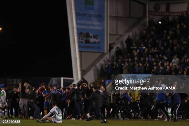 Dejected Corey Whelan of Yeovil Town as Shrewsbury Town fans invade the pitch at full time during the Checkatrade Trophy Semi Final between...