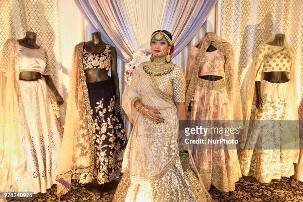 Indian model wearing an exquisite Gujarati bridal lehenga with traditional opulent jewellery in Scarborough, Ontario, Canada.