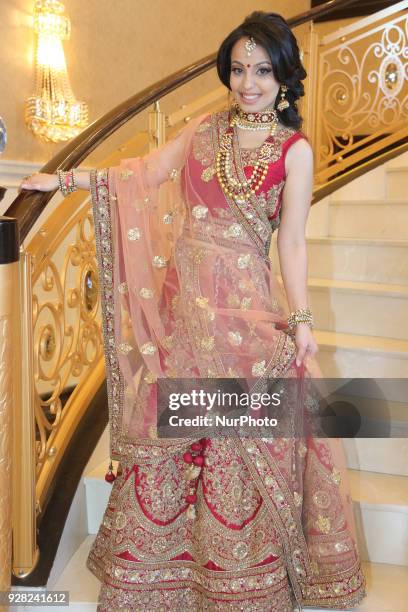 Indian model wearing an exquisite Gujarati bridal lehenga with traditional opulent jewellery in Scarborough, Ontario, Canada.