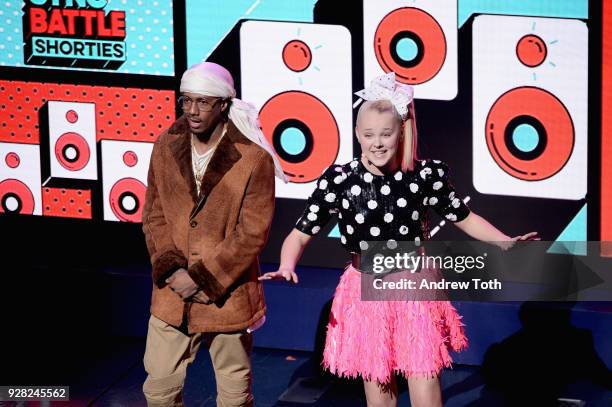 Nick Cannon and JoJo Siwa speak onstage at the Nickelodeon Upfront 2018 at Palace Theatre on March 6, 2018 in New York City.