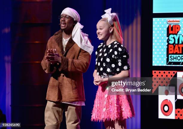 Nick Cannon and JoJo Siwa speak onstage at the Nickelodeon Upfront 2018 at Palace Theatre on March 6, 2018 in New York City.