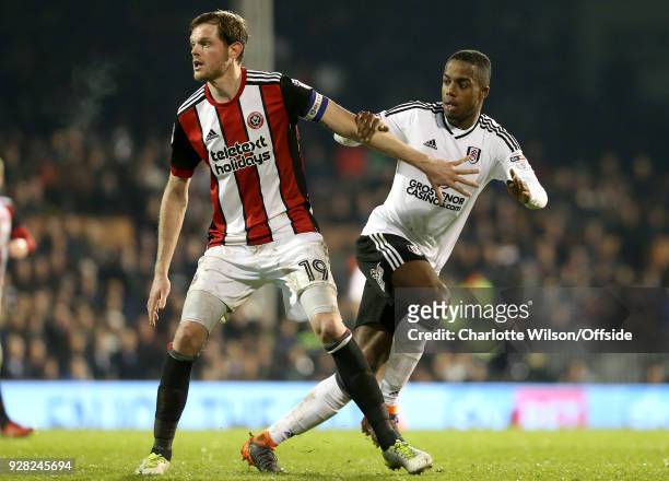 Richard Stearman of Sheffield United and Ryan Sessegnon of Fulham during the Sky Bet Championship match between Fulham and Sheffield United at Craven...