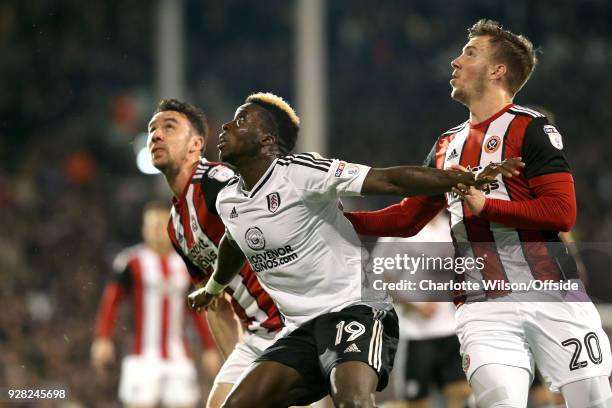 Enda Stevens of Sheffield United, Sheyi Ojo of Fulham and Lee Evans of Sheffield United look up for the ball during the Sky Bet Championship match...