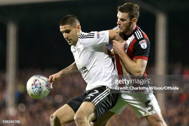 Aleksandar Mitrovic of Fulham and Jack OConnell of Sheffield United battle for the ball during the Sky Bet Championship match between Fulham and...