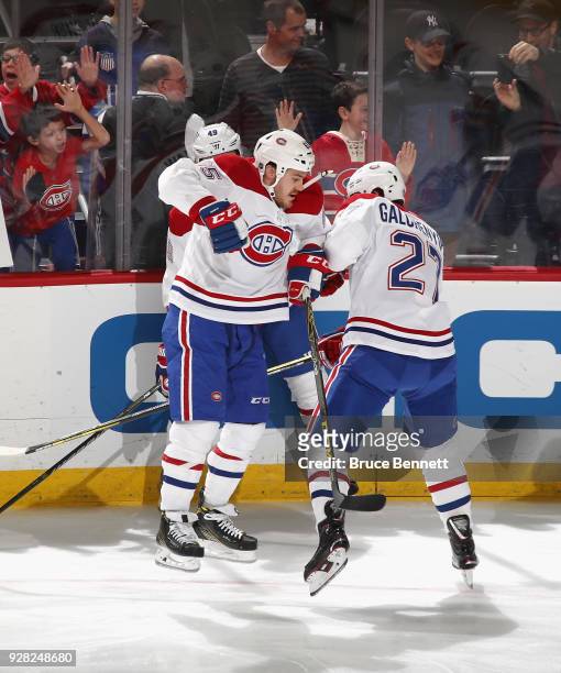 Andrew Shaw and Alex Galchenyuk of the Montreal Canadiens bump during warmups prior to the game against the New Jersey Devils at the Prudential...