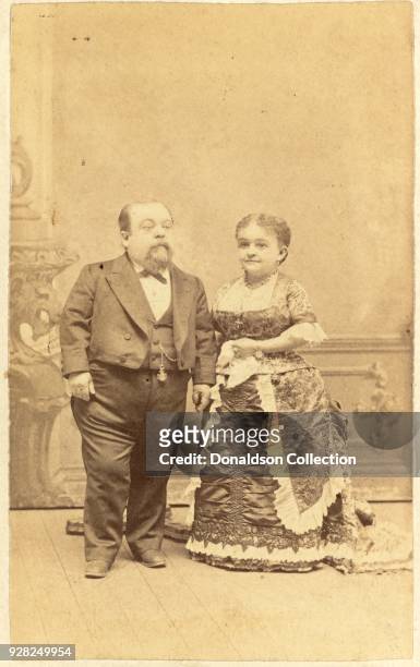 Photograph shows P.T. Barnum performers Charles Sherwood Stratton "General Tom Thumb" and Mercy Lavinia Warren Bump , in a portrait taken late in...