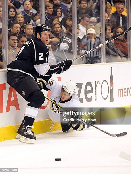 Matt Greene of the Los Angeles Kings avoids a check from Christopher Bourque of the Pittsburgh Penguins during the first period at the Staples Center...
