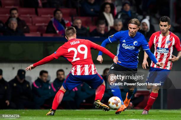 Peter Ankersen of FC Copenhague fights for the ball with Sergio Gonzalez Testan and Angel Correa of Atletico de Madrid during the UEFA Europa League...