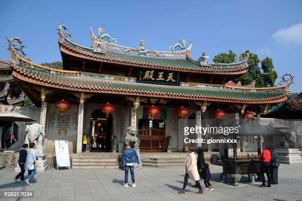 heaven king hall, nanputuo temple in xiamen, fujian province, china - south putuo temple stock pictures, royalty-free photos & images