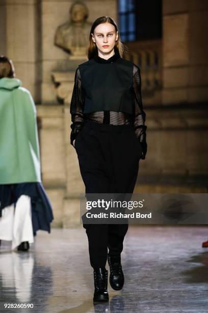 Model walks the runway during the Moon Young Hee show as part of the Paris Fashion Week Womenswear Fall/Winter 2018/2019 on March 6, 2018 in Paris,...