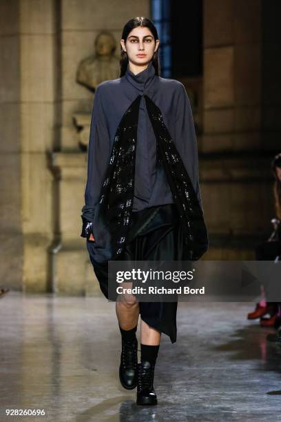 Model walks the runway during the Moon Young Hee show as part of the Paris Fashion Week Womenswear Fall/Winter 2018/2019 on March 6, 2018 in Paris,...