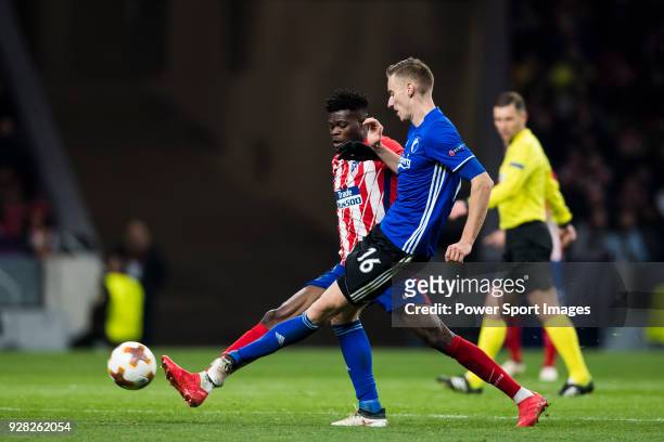 Jan Gregus of FC Copenhague fights for the ball with Thomas Teye Partey of Atletico de Madrid during the UEFA Europa League 2017-18 Round of 32 match...
