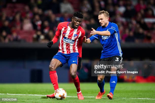 Thomas Teye Partey of Atletico de Madrid fights for the ball with Pierre Bengtsson of FC Copenhague during the UEFA Europa League 2017-18 Round of 32...