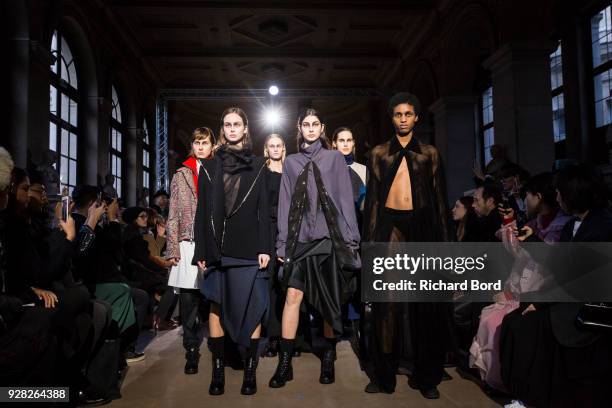 Models walk the runway during the Moon Young Hee show as part of the Paris Fashion Week Womenswear Fall/Winter 2018/2019 on March 6, 2018 in Paris,...