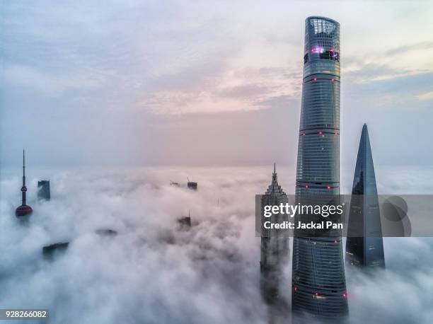 aerial view of shanghai lujiazui financial district in fog - shanghai tower shanghai photos et images de collection