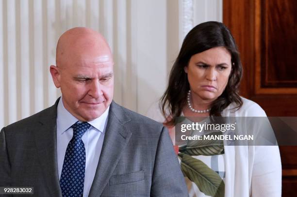 National Security Advisor H.R. McMaster and White House Press Secretary Sarah Sanders arrive for a press conference by US President Donald Trump and...