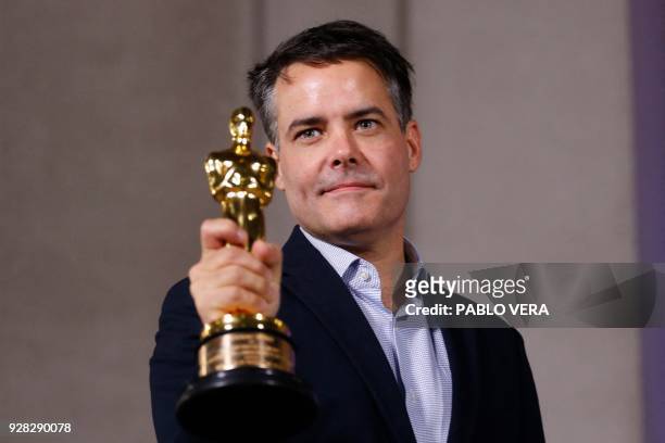 Chilean filmmaker Sebastian Lelio shows the Oscar statuette for Best Foreign Language Film won by his film "A Fantastic Woman" after a meeting with...