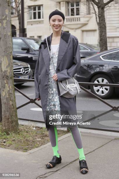 Fashion influencer, Irene Kim, seen at the Miu Miu fashion show during Paris Fashion Week Womenswear Fall/Winter 2018/2019 on March 6, 2018 in Paris,...