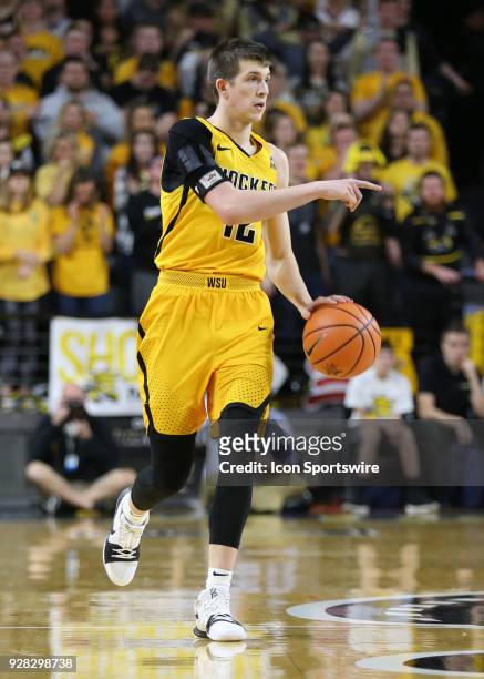 Wichita State Shockers guard Austin Reaves brings the ball upcourt in the second half of an American Athletic Conference matchup between the 10th...