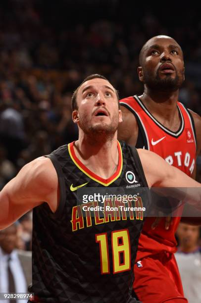 Miles Plumlee of the Atlanta Hawks plays defense against Serge Ibaka of the Toronto Raptors on March 6, 2018 at the Air Canada Centre in Toronto,...