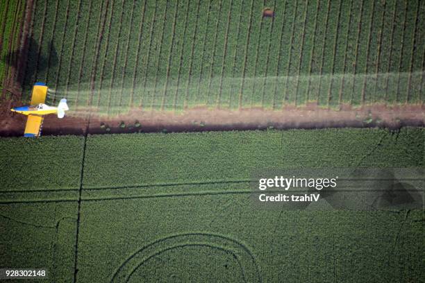 looking down on a crop duster - center pivot stock pictures, royalty-free photos & images