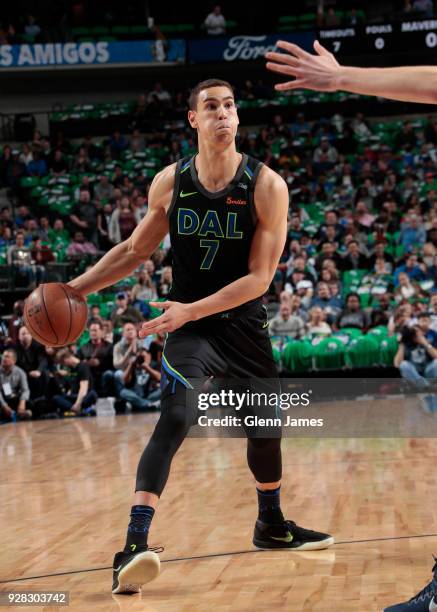Dwight Powell of the Dallas Mavericks handles the ball during the game against the Denver Nuggets on March 6, 2018 at the American Airlines Center in...