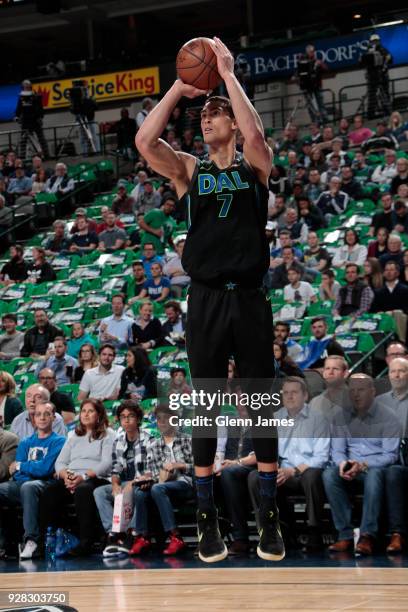 Dwight Powell of the Dallas Mavericks shoots the ball during the game against the Denver Nuggets on March 6, 2018 at the American Airlines Center in...