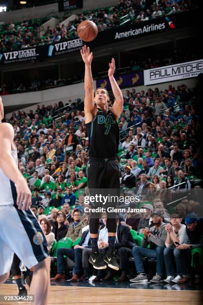 Dwight Powell of the Dallas Mavericks shoots the ball during the game against the Denver Nuggets on March 6, 2018 at the American Airlines Center in...