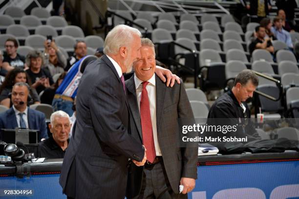 Head Coach Gregg Popovich of the San Antonio Spurs and Head Coach Brett Brown of the Philadelphia 76ers shake hands after the game on January 26,...