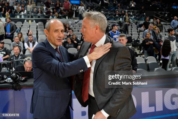 Coach Ettore Messina of the San Antonio Spurs speaks with Head Coach Brett Brown of the Philadelphia 76ers after the game on January 26, 2018 at the...