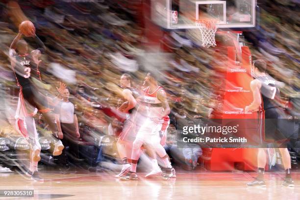 Dwyane Wade of the Miami Heat shoots in front of Markieff Morris of the Washington Wizards during the second half at Capital One Arena on March 6,...