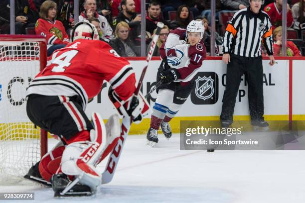 Colorado Avalanche center Tyson Jost shoots of Chicago Blackhawks goalie Jean-Francois Berube in the 2nd period during an NHL hockey game between the...