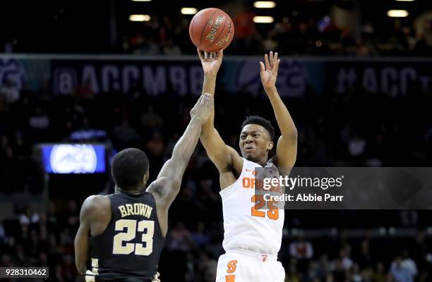 Tyus Battle of the Syracuse Orange takes a shot against Chaundee Brown of the Wake Forest Demon Deacons in the second half during the first round of...
