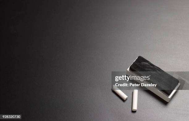 blackboard with chalk and board eraser with copy space - chalkboard eraser stockfoto's en -beelden