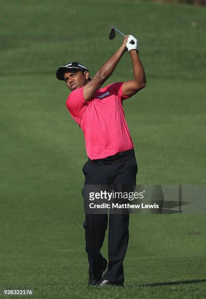 Chawrasia of India plays a shot form the 9th fairway during a practice round ahead of the Hero Indian Open at Dlf Golf and Country Club on March 7,...