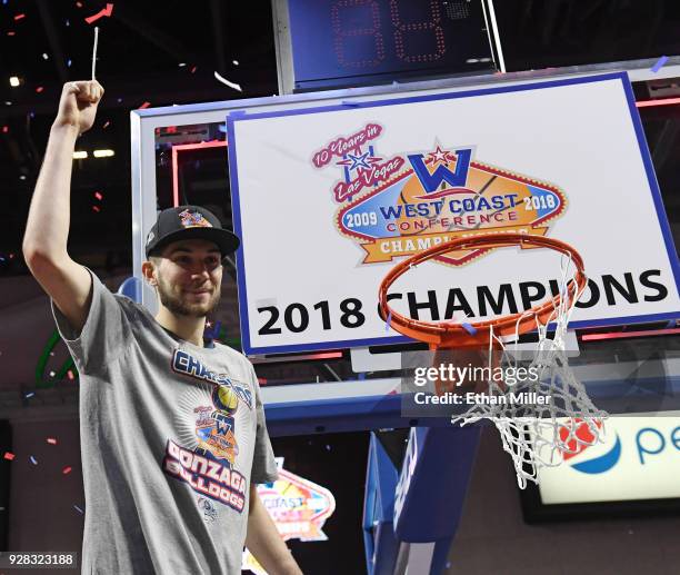 Killian Tillie of the Gonzaga Bulldogs cuts down a net after defeating the Brigham Young Cougars 74-54 to win the championship game of the West Coast...