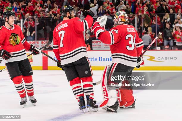Chicago Blackhawks defenseman Brent Seabrook congratulates Chicago Blackhawks goalie Jean-Francois Berube after an NHL hockey game between the...